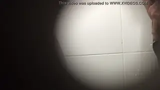 Handsome Man Lets Go at a Public Urinal