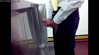 Asian Guy Strokes His Cock in a Bathroom Stall