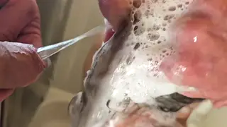 Busty Blonde MILF Gets Soaked in Piss Before Sucking an Uncut Cock