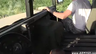 Military Men Share Interracial Blowjob in Field Setting