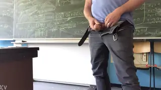 Teacher Strokes His Cock at a Classroom Desk
