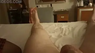 Stocking-Clad Lover Delivers a Wet Blowjob in a Hotel Suite