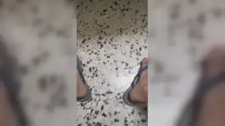 European Soldier Finishes on Comrade's Flip-Flops Outdoors