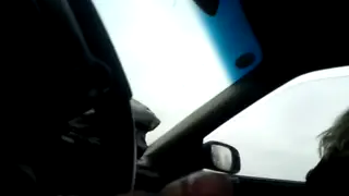 European Blowjob Unfolds in a Parked Car
