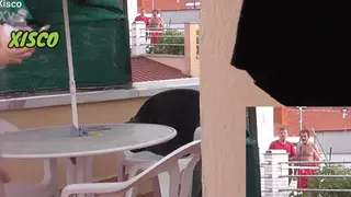 Exhibitionist Bares All on Terrace for Voyeur Neighbours