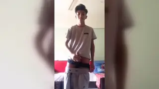 Slender Asian Teen Strokes a Muscular Stud to Completion