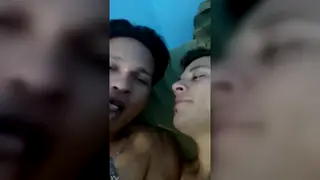 Couple Shares Quick Kiss in Casual Home Clip