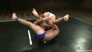 Muscular Rivals Wrestle Oiled Bodies in Gym Showdown