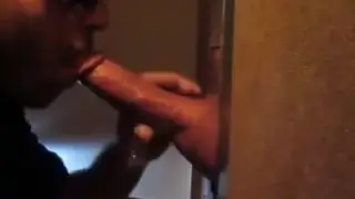 Muscular Stranger Drains Load Through Gloryhole