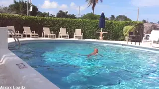 Woman Dives and Swims Laps in Outdoor Pool