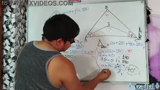 Asian Student Receives Private Lesson From Teacher at Desk