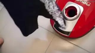 Maid Uses Vacuum Toy at a Gloryhole