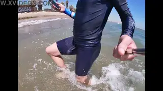 Latino Jock Flexes in Lycra on a Public Beach