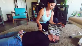 Dominant Girlfriend Teases Locked Boyfriend with Feet and Handjob