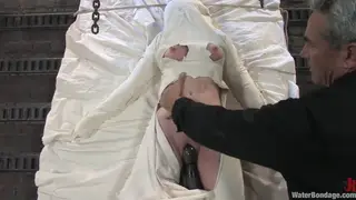 Tattooed Brunette Endures Water Bondage and Toy Torment