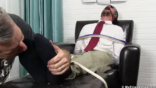 Muscular Stud Bound and Gagged for Foot Worship