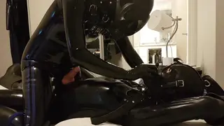 Bound Latex Gimp Takes a Toy and a Blowjob