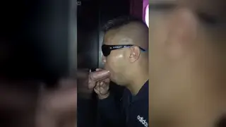 Stranger Drains a Big Cock Through a Gloryhole