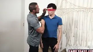 Mature Stepdad Shares Blindfolded Stepson In Bareback Threesome