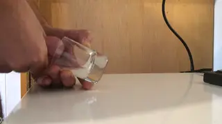 Solo Guy Fills a Glass With His Load