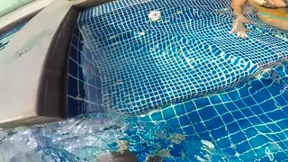 Busty Blonde Strokes a Big Cock Poolside