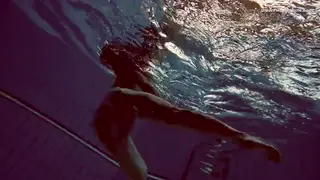 Young European Beauty Teases Underwater in Sheer Lingerie