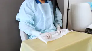 Latex-Clad Nurse Teases in Medical Gloves for Fetish Play