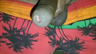 Ebony Femboy Strokes Uncut Cock in Lingerie
