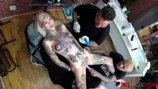 Busty Tattooed Babe Uses Toys While Getting Inked