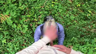 Cyclist Kneels for Outdoor Blowjob Near Trees