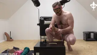 Tattooed Domme Stretches Sub With Toys and Fist