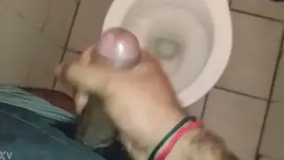 Guy Strokes to Cumshot in Office Bathroom