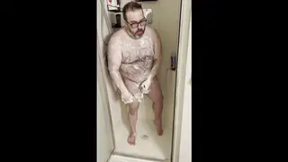 Hairy Bear Strokes His Thick Cock Under the Shower Spray