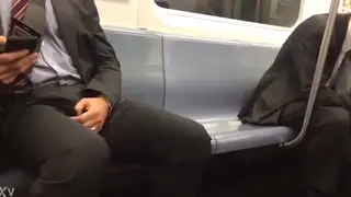 Amateur Shows Bulge in Suit During Public Train Ride