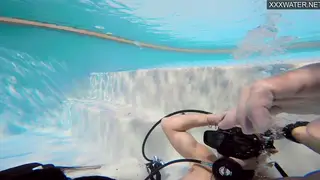 Brunette Couple Fucks Underwater in Public Pool