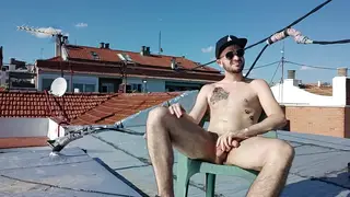 Inked European Stud Strokes Uncut Cock on a Rooftop