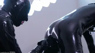 Muscular Twink Bound in Latex Takes Toy Pounding