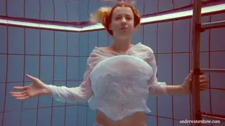Petite Redhead Teen Flashes Shaved Pussy Poolside
