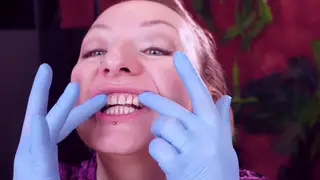 MILF in Lingerie Runs Gloved Fingers Over Face and Teeth