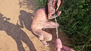 Voluptuous Ebony MILF Drenches the Outdoors in Piss