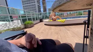 Busty MILF Jerks a Thick Load Poolside in Public
