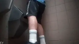 European Guy Pisses at Public Toilet Urinal