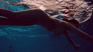 European Brunette Swims Naked in Outdoor Pool
