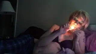 Petite Blonde Teases Her Pierced Nipples While Smoking