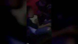 Two Friends Share a Quick Kiss at the Club