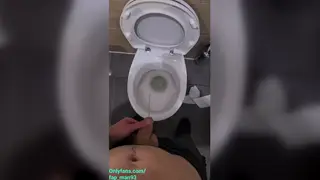 European Guy Pisses at Urinal During Work Break