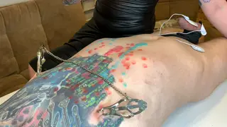 Brunette Dominatrix Drips Hot Wax Across Tattooed Submissive