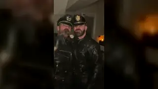 Leather-Clad Latino Enjoys a Slow Smoke Break