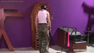 Bound Twink Endures Flogging in a Coffin Cage