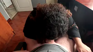 Ebony Employee Kneels for Boss at Office Desk